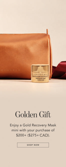 A small gold jar labeled BANTECALLS on a beige background with a tan pouch and a dark red ribbon above, plus promotional text reading 'Golden Gift' and 'Enjoy a Gold Recovery Mask mini with your purchase of $200+ ($275+ CAD).'.